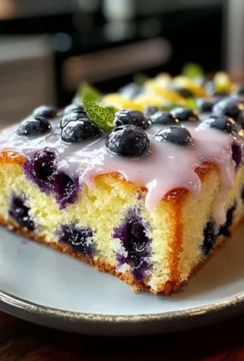 Moist Lemon Blueberry Poke Cake Recipe with Easy Zesty Glaze