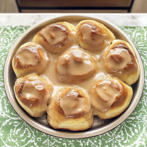 Rolls1 qt. whole milk 1 cup vegetable oil 1 cup sugar2 (0.25-oz.) packets active dry yeast 8 cups all-purpose flour1 cup (additional) all-purpose flour 1 tsp. (heaping) baking powder1 tsp. (scant) baking soda1 Tbsp. (heaping) iodized table salt1 1/2 cups melted salted butter2 cups sugar3 Tbsp. ground cinnamon (plus more to taste)